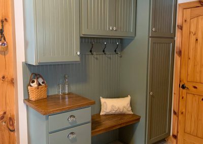 Entryway cabinets with coat hooks and convenient seating